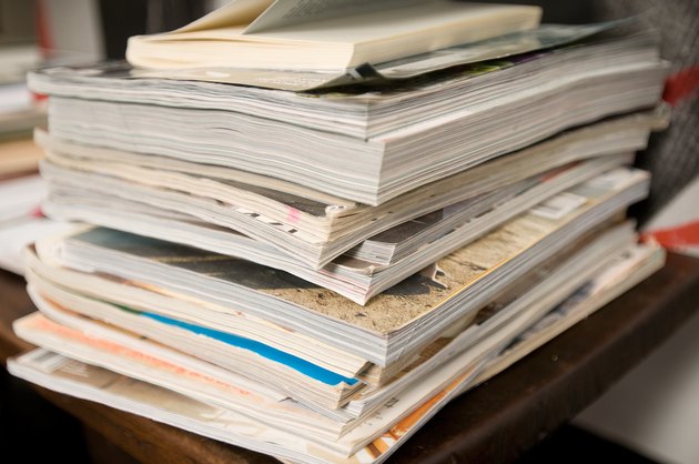 Stack of magazines and catalogs on desk