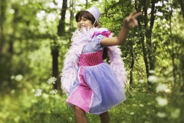 Running pre-teen girl wearing princess costume