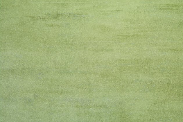 Olive green obsolete wall background
