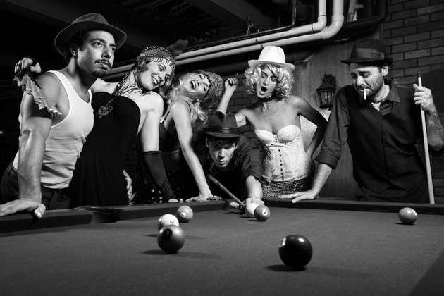 Retro group playing pool.