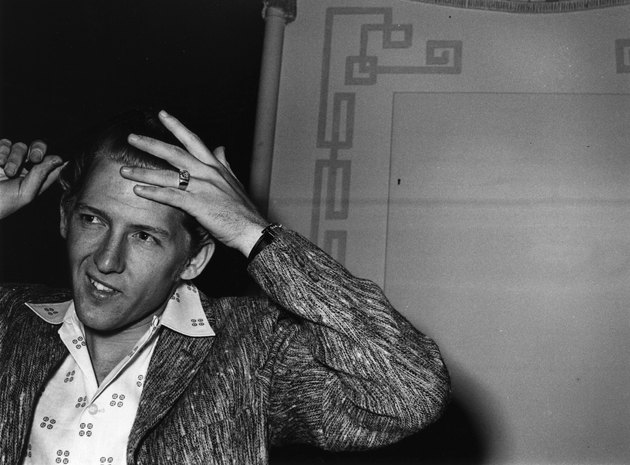 Controversial rocker Jerry Lee Lewis combing his hair in London. (Photo by Evening Standard/Getty Images)