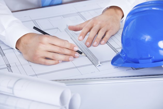 Architect Working On Blueprint