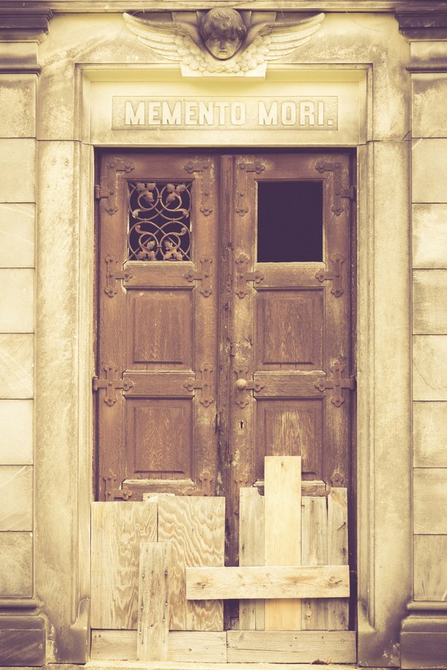 boarded up door to a crypt