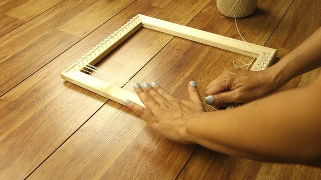 Checking tension while warping DIY simple frame loom.