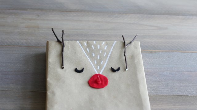 Twigs glued to top of box for antlers