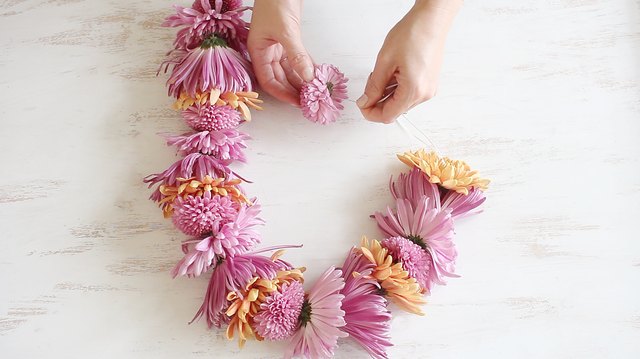 String flowers together with needle
