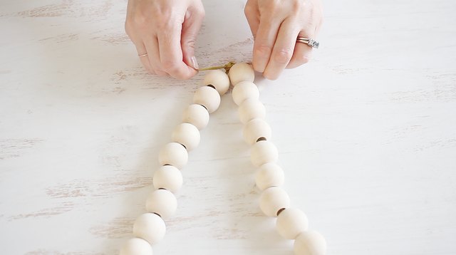 Tying ends of ribbon together