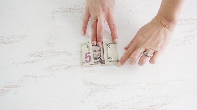Folding ends of bill to center