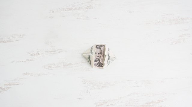 Folding corners of bill