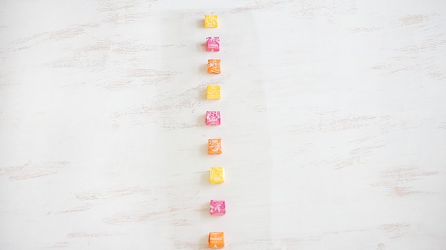 Candy lined up on cellophane