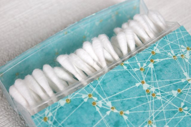 Transform empty plastic gum holders into first aid kits, sewing kits, gift card holders, and q-tip holders.