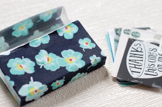 Transform empty plastic gum holders into first aid kits, sewing kits, gift card holders, and q-tip holders.