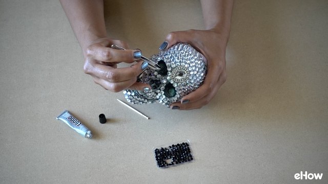 Encrust Eye Holes and Nose Hole with Darker Gemstones