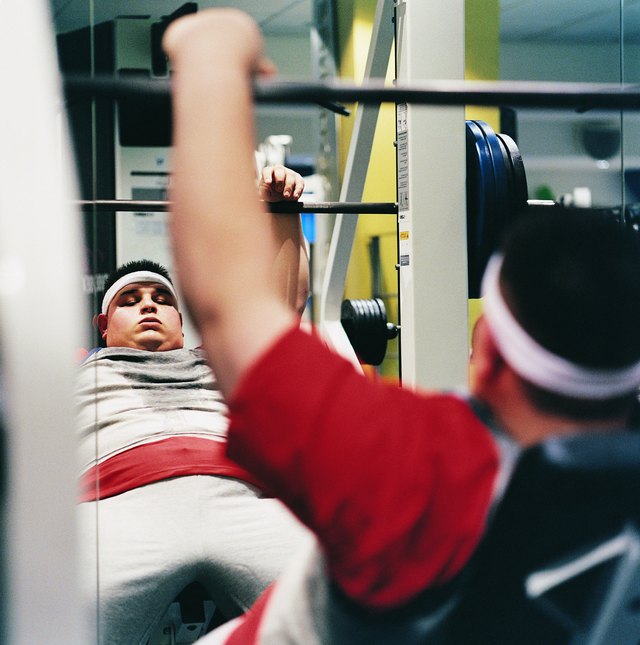 Man Weight Training in a Gym