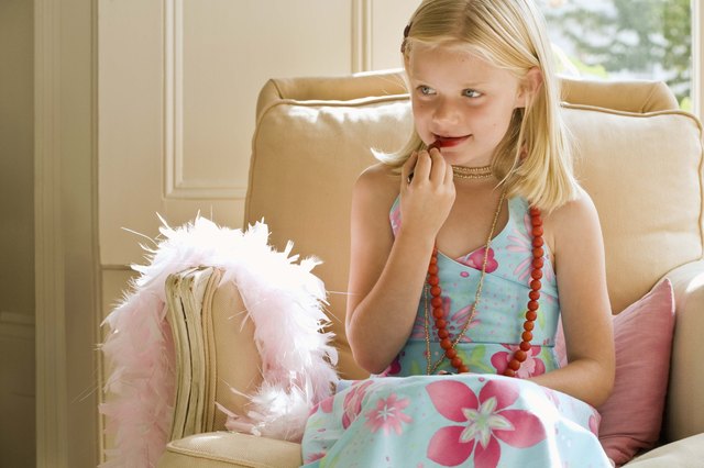 Girl playing with lipstick