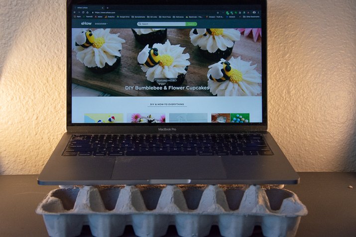 an image of laptop stand made from an egg carton