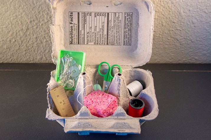 an image of a sewing kit made from an egg carton