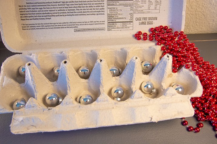 an image of an ornament holder made from an egg carton