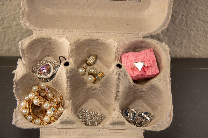 an image of jewelry holder made from an egg carton