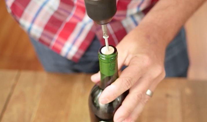 Open a wine bottle with a screw