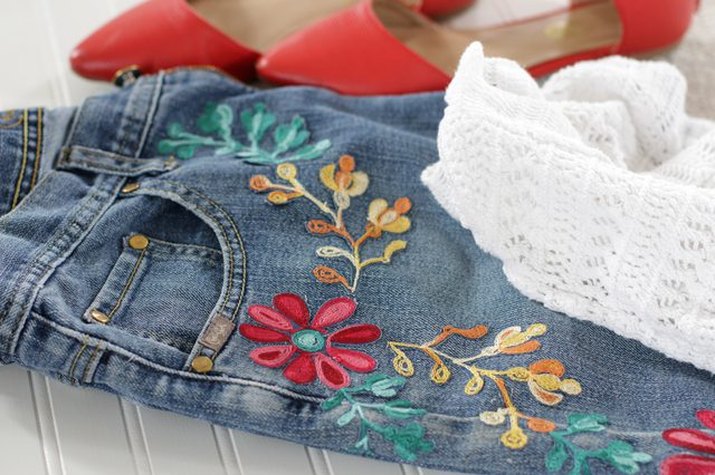 Colorful floral embroidery on denim