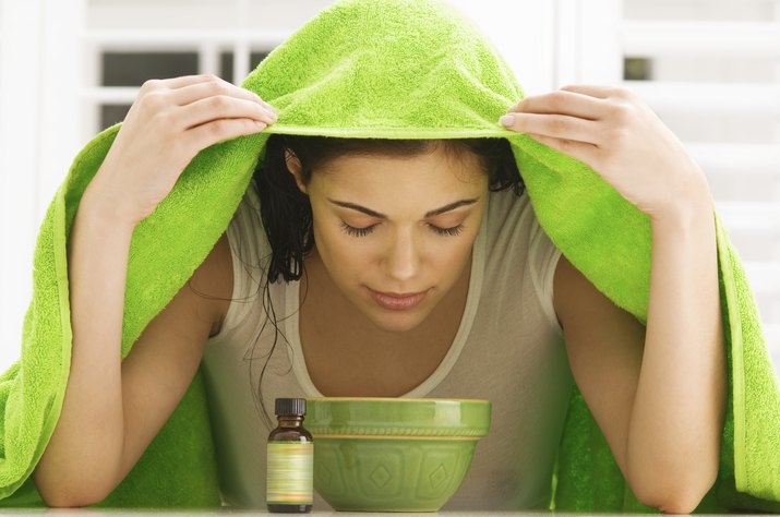 Woman inhaling over a bowl