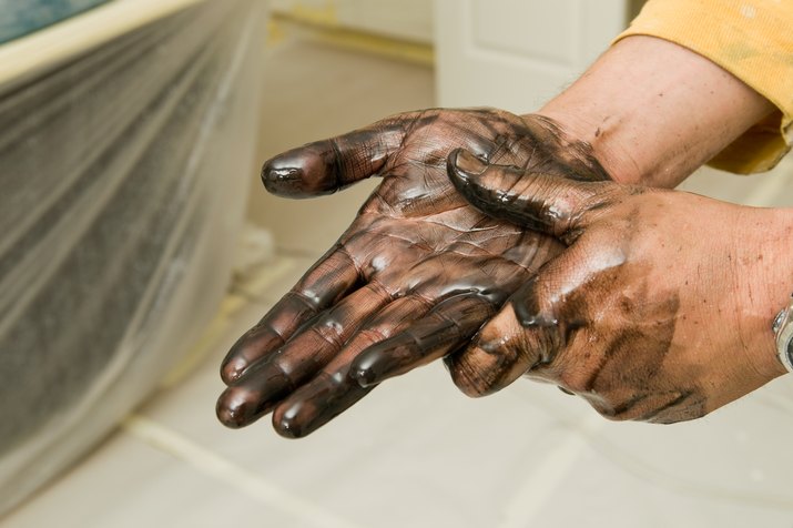 Painter Washing Stained Hands with Lacquer Thinner