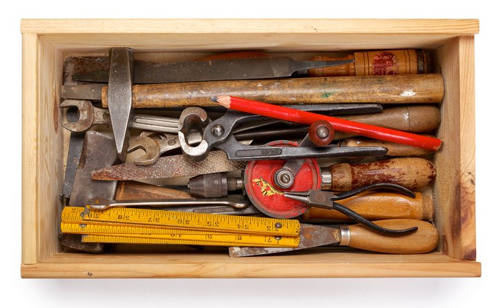 Vintage hand tools in a wooden box with clipping path