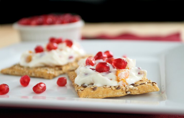 Pomegranate apricot cream cheese spread on cracker