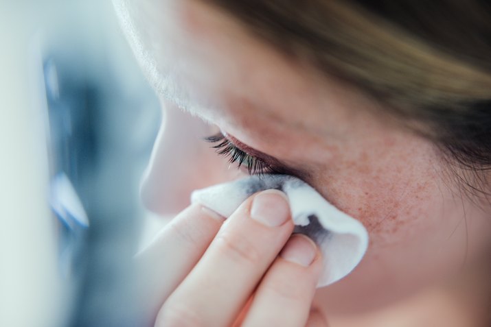 Woman removing make up.