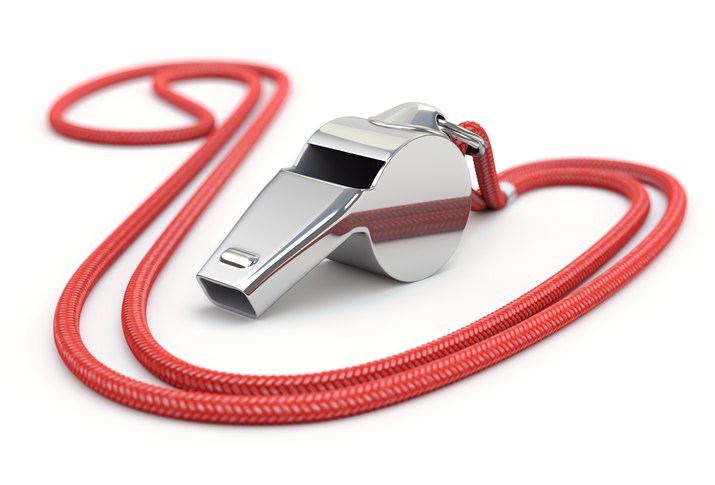 Shiny silver whistle with red string