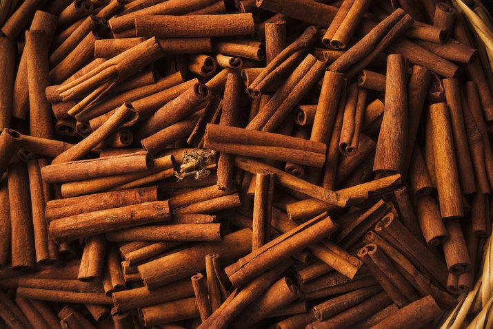 barrel of fresh cinnamon sticks for sale at a souk market in Chefchaouen, Morocco, North Africa