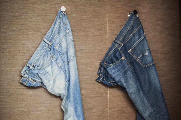 Faded jeans hanging on a wall