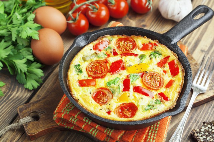 Omelet with vegetables and cheese. Frittata