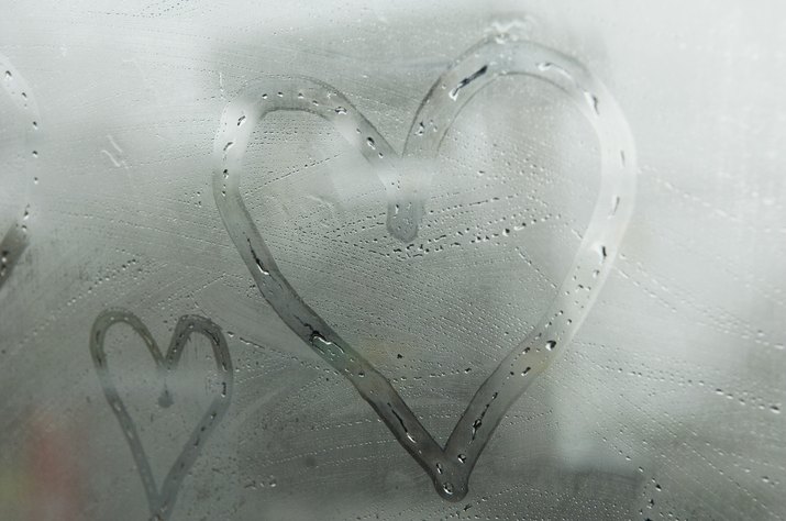 Hearts drawn on fogged window