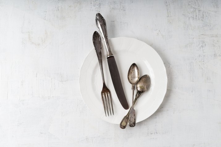 Silver cutlery on plate