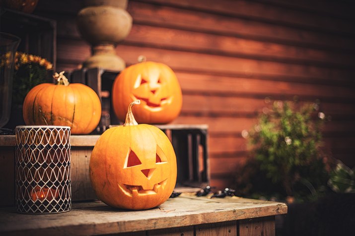 Pumpkins on front step with halloween decorations