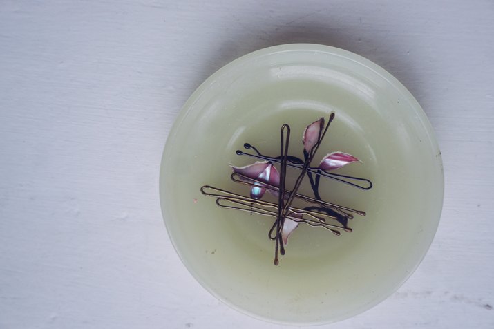 Directly Above Shot Of Hairpins In Plate On Table