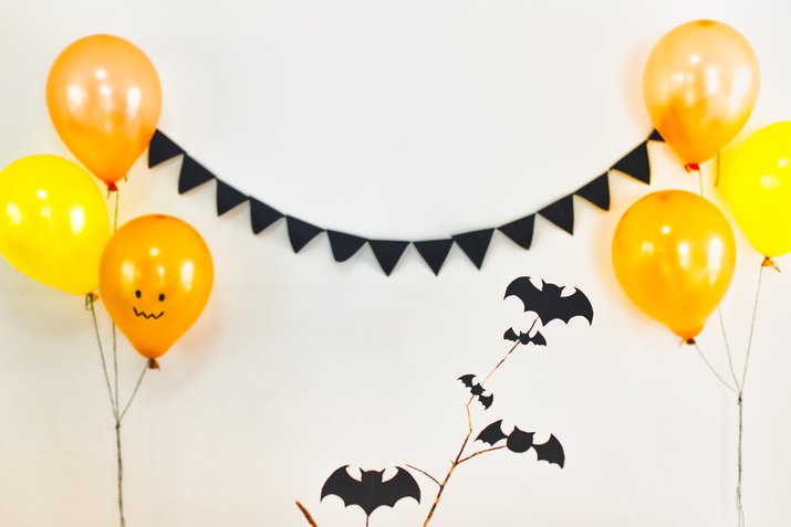 Balloons With Halloween Decorations Hanging On Wall