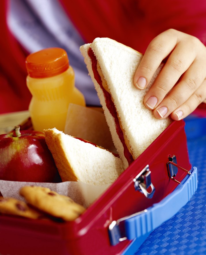 Child taking sandwich out of lunchbox