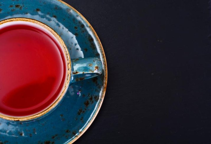 Red Tea in Beautiful Cup. Studio Photo