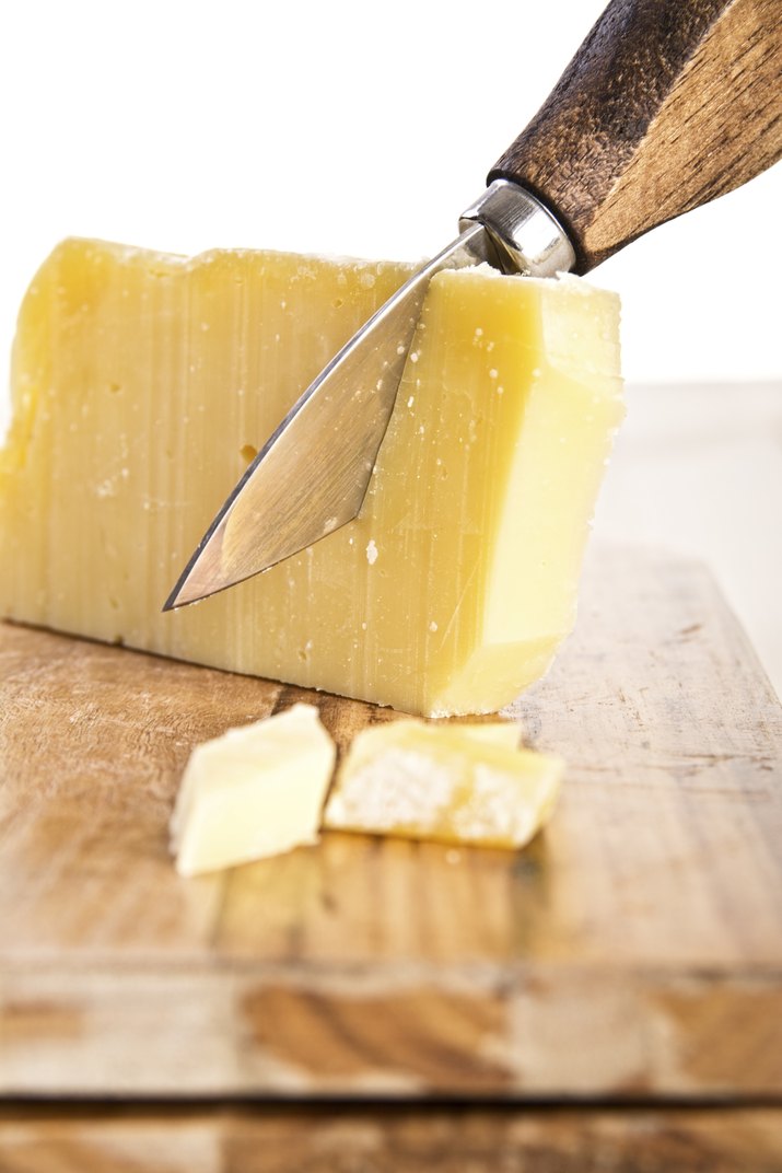 wooden handle knife and parmesan cheese