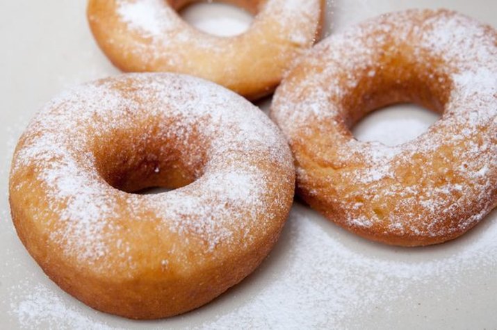 Golden-fried doughnuts sprinkled with granulated sugar