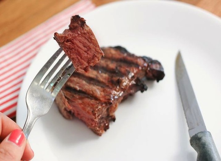 Plate of grilled New York strip steak.
