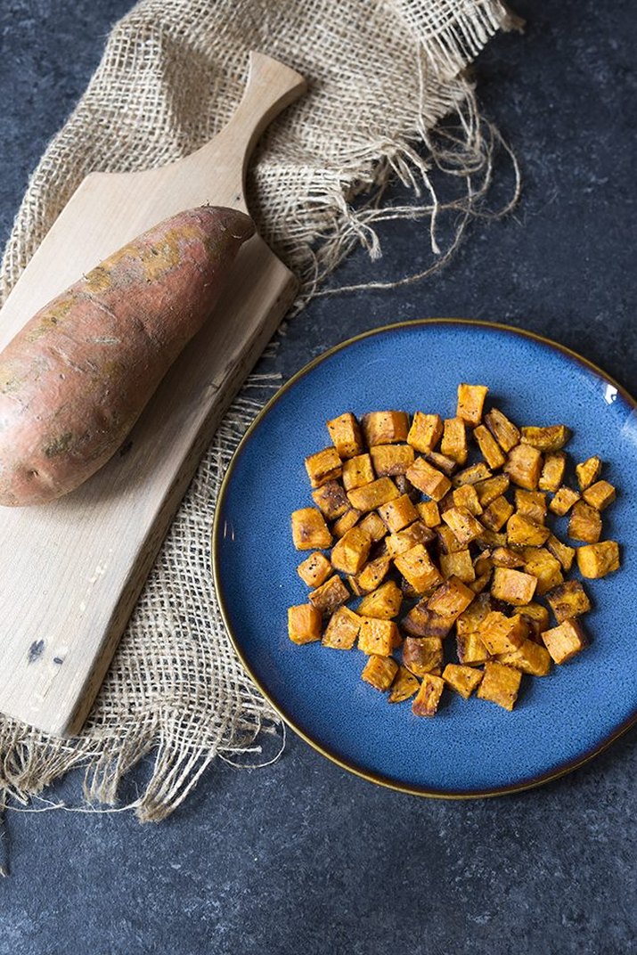 A plate of roasted and diced sweet potatoes.