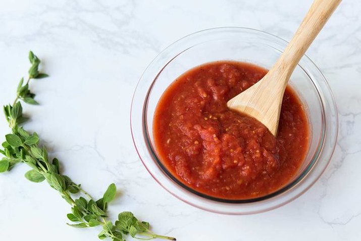 Homemade pizza sauce with fresh herbs