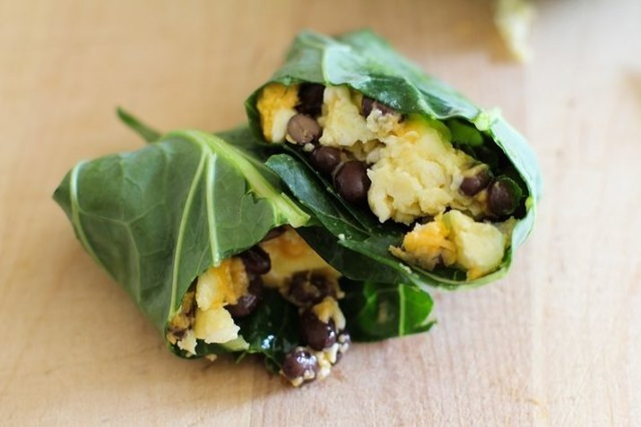Low-carb egg, bean and cheese breakfast burrito served in a collard wrap.