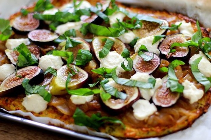 A vibrant, fig, basil and risotto pizza with cauliflower pizza crust.