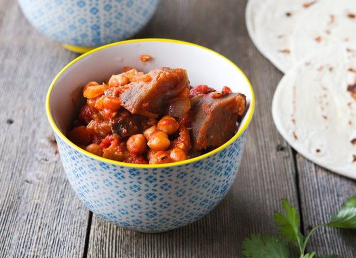 A bowl of spiced chickpea and eggplant stew.