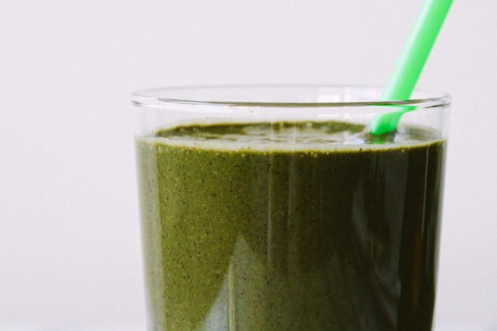 A breakfast smoothie made with berries and leafy greens.